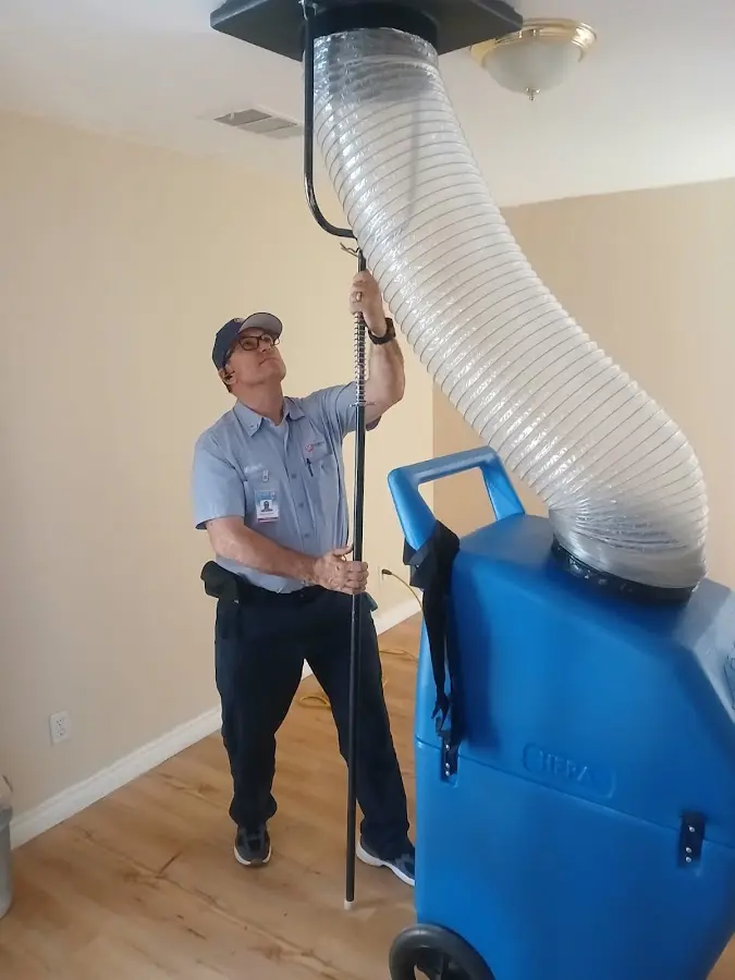 Furnace Tune-Up technician using HEPA equipment in Vidalia